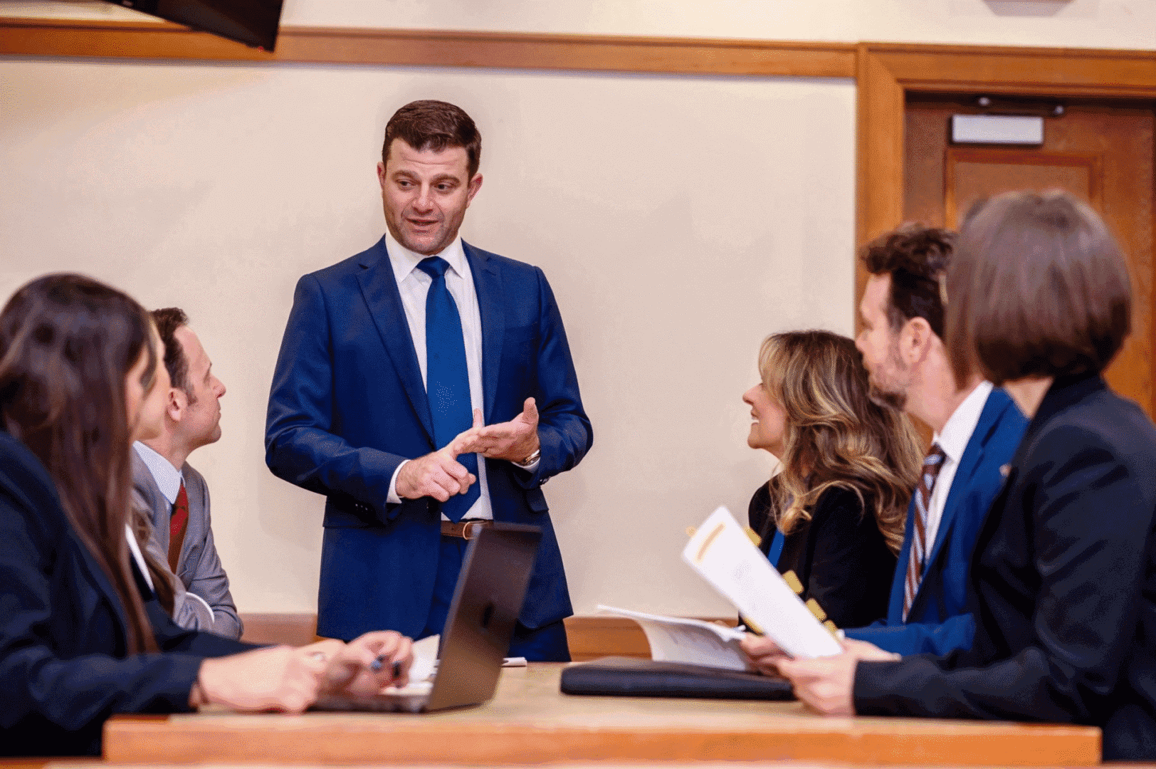 Business meeting with people in formal attire.